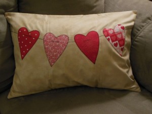 String of hearts pillow